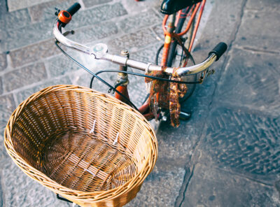 Wicker,Bicycle,Basket.,Vintage,Bike,On,The,Street,As,Background.